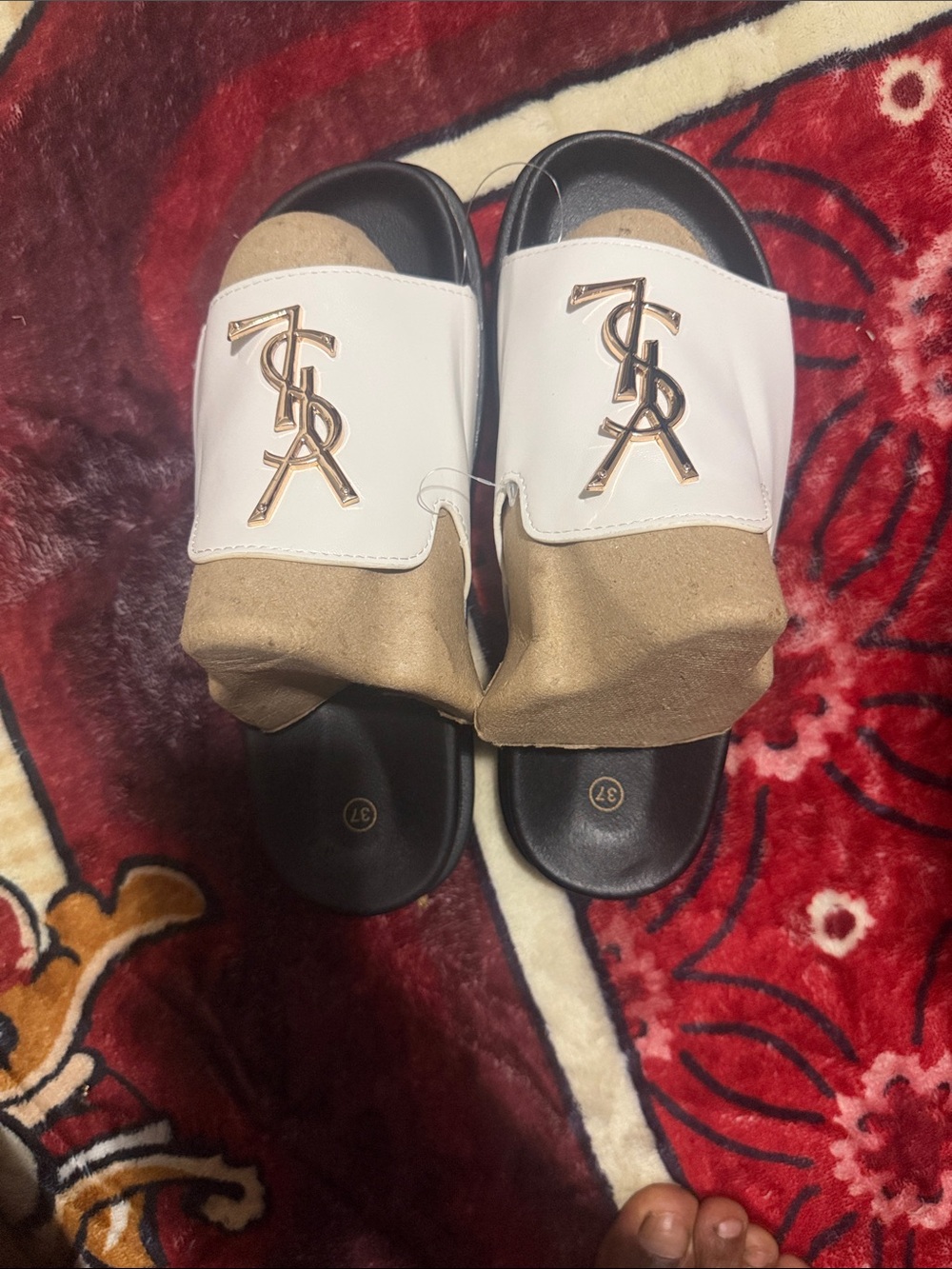 White and Black Men's Slide Sandals with Gold Emblem